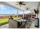 Inviting back porch with comfortable seating, offering scenic views of the pond and backyard at 302 Lucca Dr, Summerville, SC 29486