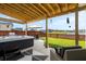 Backyard oasis featuring a hot tub, outdoor seating, a well-manicured lawn, and scenic views at 302 Lucca Dr, Summerville, SC 29486