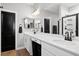 Modern bathroom with double vanity, stylish lighting, and black hardware accents at 302 Lucca Dr, Summerville, SC 29486