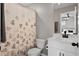 Modern bathroom with a floral shower curtain, a white vanity, and gray walls at 302 Lucca Dr, Summerville, SC 29486