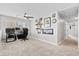 Bedroom area with plush carpeting and a ceiling fan, ideal for work or relaxation at 302 Lucca Dr, Summerville, SC 29486
