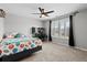 Bright bedroom with carpet, a ceiling fan, and natural light, featuring unique decor at 302 Lucca Dr, Summerville, SC 29486