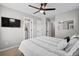 Cozy bedroom with a large bed and a ceiling fan, featuring access to the bathroom at 302 Lucca Dr, Summerville, SC 29486