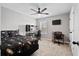 Spacious bedroom with carpet, a ceiling fan, and a unique dark-themed design at 302 Lucca Dr, Summerville, SC 29486