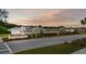 Welcome to Woodwinds, featuring an elegant community entrance with lush landscaping and scenic views at 302 Lucca Dr, Summerville, SC 29486