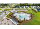 Aerial view of the pool and community with a beautiful pool, pergolas, and lounge chairs at 302 Lucca Dr, Summerville, SC 29486