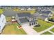 Charming two-story home featuring lush green lawn, attached garage, and beautiful landscaping at 302 Lucca Dr, Summerville, SC 29486
