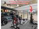 Spacious garage area equipped for fitness with sliding screen door and gym equipment at 302 Lucca Dr, Summerville, SC 29486