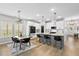 Bright and airy kitchen with modern appliances, a center island, and adjacent dining area with natural light at 302 Lucca Dr, Summerville, SC 29486