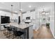 Modern kitchen featuring white cabinets, a gray island with seating, and stainless steel appliances at 302 Lucca Dr, Summerville, SC 29486