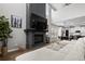 Cozy living room featuring a fireplace with a large TV, plush sofa, and open layout at 302 Lucca Dr, Summerville, SC 29486