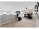 Open loft area with plush carpeting and a ceiling fan, ideal for work or relaxation at 302 Lucca Dr, Summerville, SC 29486
