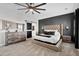 Contemporary main bedroom featuring a tufted headboard, dark accent wall, and elegant furnishings at 302 Lucca Dr, Summerville, SC 29486