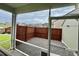 Screened-in patio features a view of a fenced backyard with a private, gravel-covered area at 302 Lucca Dr, Summerville, SC 29486
