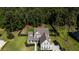 Aerial view of a well-kept home surrounded by a lush green lawn and mature trees at 3025 Rampart Rd, Summerville, SC 29483