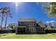 Expansive backyard with a screened-in porch, providing a relaxing outdoor living space at 3025 Rampart Rd, Summerville, SC 29483