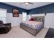 Cozy bedroom with decorative navy accent wall, featuring a comfortable bed and soft lighting at 3025 Rampart Rd, Summerville, SC 29483
