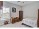 Comfortable bedroom with neutral walls, plush carpet, window and wooden furniture at 3025 Rampart Rd, Summerville, SC 29483