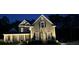 Home exterior at night, showcasing professional outdoor lighting and manicured landscaping at 3025 Rampart Rd, Summerville, SC 29483