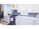 Bright kitchen features white cabinets, stainless steel appliances, and stylish backsplash at 3025 Rampart Rd, Summerville, SC 29483