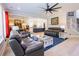 Spacious living room open to the kitchen with modern furnishings and hardwood floors at 3025 Rampart Rd, Summerville, SC 29483