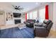 Comfortable living room with fireplace, built-in shelving, and modern furnishings at 3025 Rampart Rd, Summerville, SC 29483