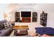 Finished attic space used as entertainment room featuring a large television and comfortable seating area at 3025 Rampart Rd, Summerville, SC 29483