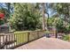 Wood deck overlooking large fenced backyard with storage shed and manicured lawn at 31 Lyttleton St, Charleston, SC 29407