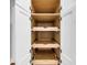 Interior of a bright white kitchen cabinet equipped with wooden sliding drawers for optimal storage and organization at 31 Lyttleton St, Charleston, SC 29407