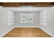 Bright and modern office space featuring hardwood floors, built-in shelving, and natural light at 31 Lyttleton St, Charleston, SC 29407