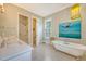 Bright bathroom with a clawfoot tub, tiled floors, a spacious shower, and modern finishes at 312 Hobcaw Dr, Mount Pleasant, SC 29464