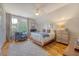 Cozy bedroom with hardwood floors, a comfortable bed, and natural light from the windows at 312 Hobcaw Dr, Mount Pleasant, SC 29464