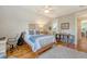 Bedroom with hardwood floors, a comfortable bed, and a bathroom conveniently located nearby at 312 Hobcaw Dr, Mount Pleasant, SC 29464