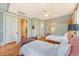 Inviting bedroom with two beds, hardwood floors, ensuite, and walk-in closet for ample storage at 312 Hobcaw Dr, Mount Pleasant, SC 29464