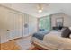 Bedroom with hardwood floors, a comfortable bed, soft natural light, and ample closet space at 312 Hobcaw Dr, Mount Pleasant, SC 29464