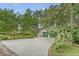 Lovely home showcasing a driveway, lush landscaping, and a two-car garage, exuding curb appeal at 312 Hobcaw Dr, Mount Pleasant, SC 29464