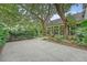 Beautiful home featuring a large driveway, screened porch and mature trees, offering a tranquil setting at 312 Hobcaw Dr, Mount Pleasant, SC 29464