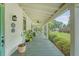 Inviting covered front porch with a ceiling fan, offering a comfortable and breezy outdoor space at 312 Hobcaw Dr, Mount Pleasant, SC 29464