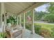 Charming covered front porch with cozy seating, ideal for enjoying the outdoors and neighborhood views at 312 Hobcaw Dr, Mount Pleasant, SC 29464
