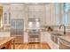 Bright kitchen boasts white cabinets, stainless steel appliances, granite counters, and an undermount sink at 312 Hobcaw Dr, Mount Pleasant, SC 29464