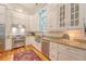 Well-appointed kitchen featuring white cabinetry, stainless steel appliances, and a stylish farmhouse sink at 312 Hobcaw Dr, Mount Pleasant, SC 29464