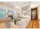 Comfortable living room features stylish decor, hardwood floors, fireplace, and a large sectional sofa at 312 Hobcaw Dr, Mount Pleasant, SC 29464