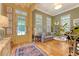 Bright and inviting living room with hardwood floors, neutral tones, and large windows at 312 Hobcaw Dr, Mount Pleasant, SC 29464