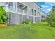 Backyard with lush green grass and the rear view of residential homes at 313 Lanyard St, Johns Island, SC 29455
