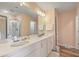 Spacious bathroom with double sink vanity, large mirror, and a glass door shower at 313 Lanyard St, Johns Island, SC 29455