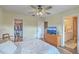 Bedroom featuring a ceiling fan, comfortable bed, dresser with a TV and access to the bathroom and walk-in closet at 313 Lanyard St, Johns Island, SC 29455