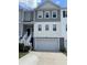 Charming townhouse with gray and white siding, a two-car garage, and a private entrance staircase at 313 Lanyard St, Johns Island, SC 29455