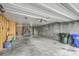 Spacious garage featuring concrete block walls and a roll-up door, offering ample storage and parking at 313 Lanyard St, Johns Island, SC 29455