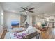Open-concept living room showcasing the staircase and dining area, with bright light and neutral tones at 313 Lanyard St, Johns Island, SC 29455
