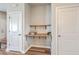 Convenient office nook with a built-in desk between two doors, perfect for a compact workspace at 313 Lanyard St, Johns Island, SC 29455